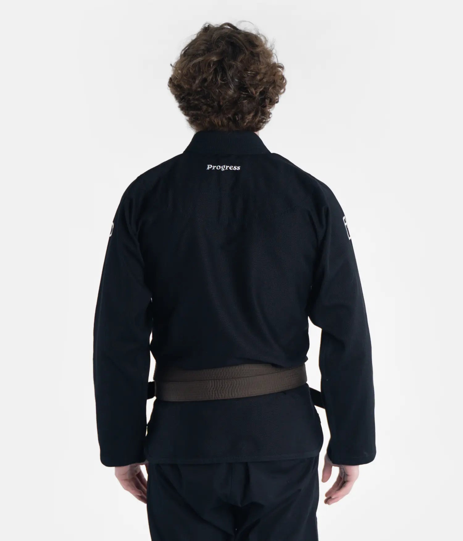 Kimono Brazilian Jiu Jitsu PROGRESS Negru poza facuta pe un model din spate